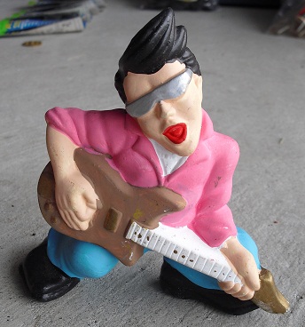 Unique Ceramic Guitar Playing Boy Figurine