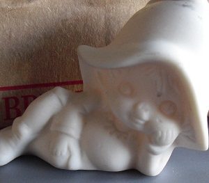 Porcelain Bisque Child with Large Hat Figurine