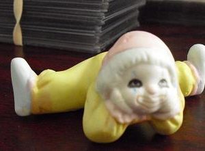 Bisque Clown Child Lying Down Figurine