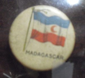 1890s Tin Tobacco Pinback - Madagascar